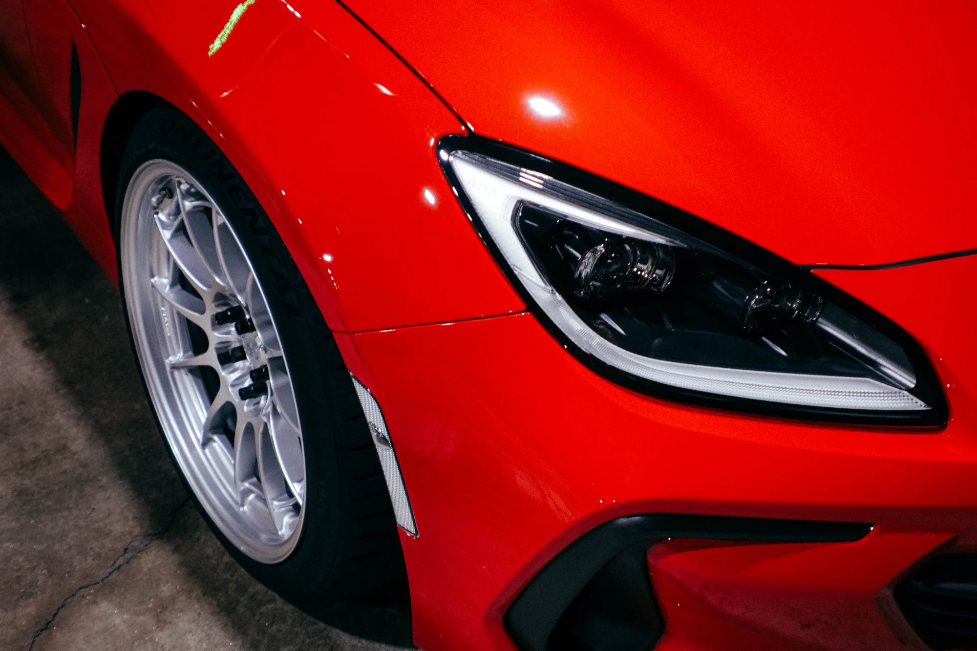 Red BRZ with Enkei wheels - front quarter view